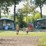 two children playing in a park at vakantiepark Ter Spegelt